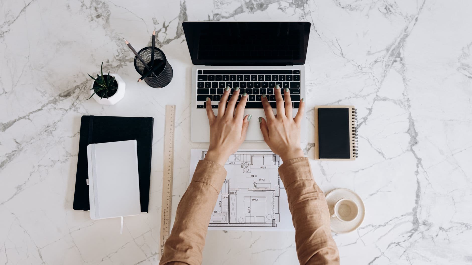 A person sitting at a desk with a laptop, looking confident and ready to start their freelance career.